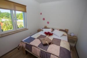 Postel nebo postele na pokoji v ubytování Apartment Krista Tinjan