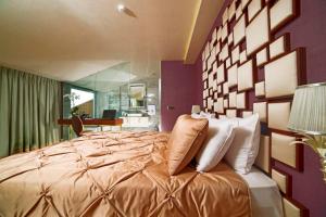 a bedroom with a large bed and a desk at Taba Luxury Suites and Hotel in Istanbul
