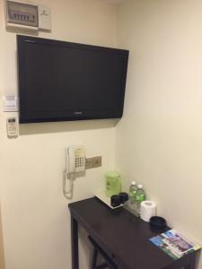 TV a/nebo společenská místnost v ubytování One Avenue Hotel