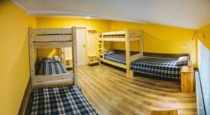 Postel nebo postele na pokoji v ubytování Alina Hotel & Hostel