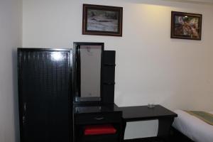 Rúm í herbergi á Hotel Gallery Nepal