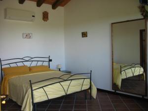 Postel nebo postele na pokoji v ubytování Agriturismo Cascina Aguzza