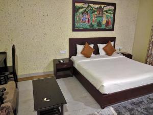 Cama o camas de una habitación en Syna Heritage Hotel