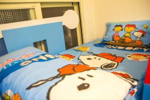 Een bed of bedden in een kamer bij Childlike B&B