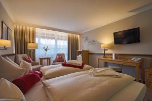 Postel nebo postele na pokoji v ubytování Thermenhotel Apollo + 37 fotografií