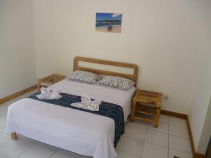 Postel nebo postele na pokoji v ubytování Dewi Garden Guesthouse