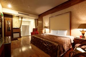 Postel nebo postele na pokoji v ubytování Treasure Island Motel - Fengshan