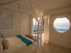 Säng eller sängar i ett rum på Bahia Mar Beach House
