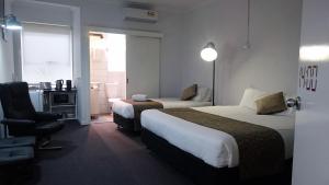 Кровать или кровати в номере Siesta Central Apartments