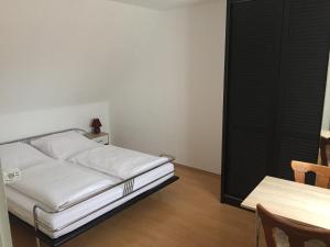Ein Bett oder Betten in einem Zimmer der Unterkunft Hotel Stadt Mainz