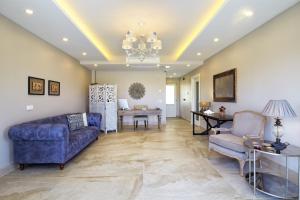 a living room with a couch and a table at Eritrina Alacati in Alacati