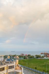 a rainbow in the sky over a city at Apartment on Parkova 36 in Chornomorsk
