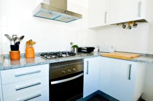 Virtuvė arba virtuvėlė apgyvendinimo įstaigoje Vila 832