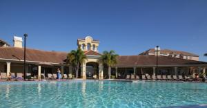 a large swimming pool in front of a building at Cayview Condo #231537 in Orlando