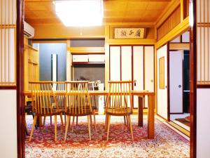 a dining room with a table and chairs at K's Villa Hida-an in Takayama