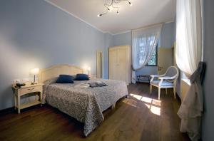 Postel nebo postele na pokoji v ubytování Relais Corte Cavalli