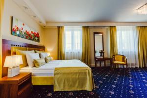 Łóżko lub łóżka w pokoju w obiekcie Grein Hotel