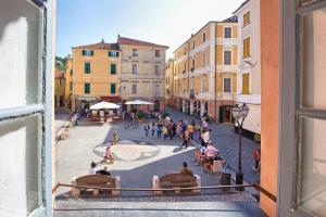a view of a city street from a window at Casa del Borgo in Finale Ligure
