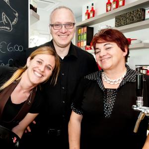 a man and two women posing for a picture at Hotel Rubino in Nago-Torbole