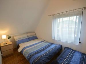 Postel nebo postele na pokoji v ubytování Domki wakacyjne 4 YOU