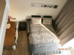Postel nebo postele na pokoji v ubytování Vakantiehuisje Bredene