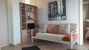 A television and/or entertainment centre at Foivos Seaside Apartments