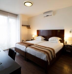 Ein Bett oder Betten in einem Zimmer der Unterkunft Hotel Casa Beltran