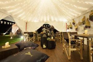 a tent with a table and chairs and a table and a bed at Japan Room 104-B KhaoYai at TVL เขาใหญ่ in Phayayen +78 photos