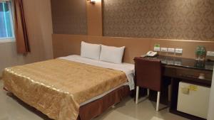 Letto o letti in una camera di Hua Xiang Motel - Arena