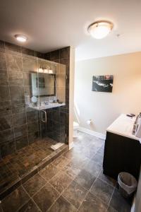 a bathroom with a shower and a sink at The Escape in Lewisburg