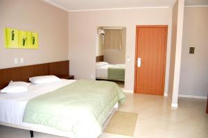 Ένα ή περισσότερα κρεβάτια σε δωμάτιο στο Hotel e Restaurante Bordignon