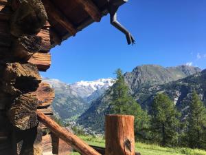 a view of mountains from a log cabin at Baite Cialvrina in Gressoney-Saint-Jean