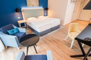 Postel nebo postele na pokoji v ubytování Boutique-Hotel Zur alten Post