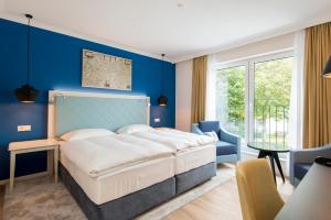Postel nebo postele na pokoji v ubytování Boutique-Hotel Zur alten Post