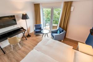 Postel nebo postele na pokoji v ubytování Boutique-Hotel Zur alten Post