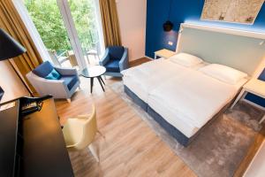 Postel nebo postele na pokoji v ubytování Boutique-Hotel Zur alten Post
