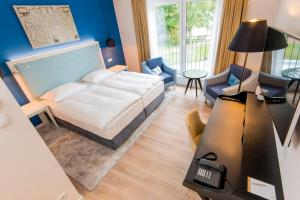Postel nebo postele na pokoji v ubytování Boutique-Hotel Zur alten Post + 27 fotografií