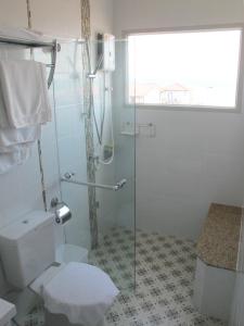 a bathroom with a toilet and a glass shower at Chill Days @ Koh Larn in Ko Larn