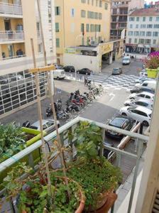 a balcony with a view of a parking lot with cars at Nissa la Bella in Nice