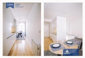 cocina y sala de estar con paredes blancas y mesa. en ORM - Almada Apartments, en Oporto