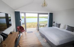 Postel nebo postele na pokoji v ubytování Magma Hotel