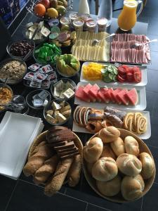 a table topped with lots of different types of food at Pension Fürstenhof in Villach