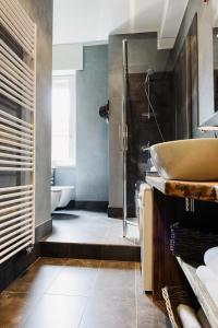 a bathroom with a sink and a shower at Suite11 Como apartment in Como