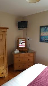 Postel nebo postele na pokoji v ubytování Elderberry B&B