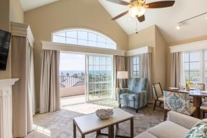 a living room with a large window at Villa L'Auberge in San Diego