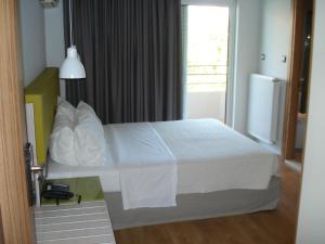 Postel nebo postele na pokoji v ubytování Elements Rooms & Apartments