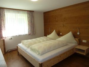Voodi või voodid majutusasutuse Ferienhaus Schwendehof toas