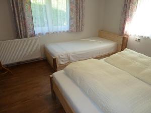 Voodi või voodid majutusasutuse Ferienhaus Schwendehof toas