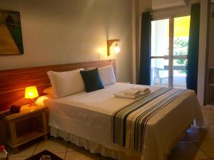Uma cama ou camas num quarto em Hotel Porto Di Mare