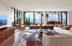a living room with a couch and a tv at Andaz Maui at Wailea Resort - A Concept by Hyatt in Wailea